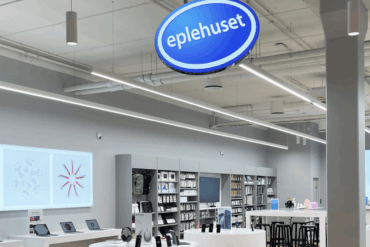 Eplehuset-butikk med Apple-produkter utstilt og logo synlig, illustrasjon på oppkjøpet fra Elkjøp.