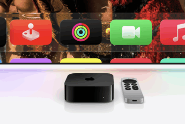 Apple TV 4K med Siri Remote plassert foran en TV-skjerm som viser appikoner som Trening, Aktivitet, FaceTime og Musikk.